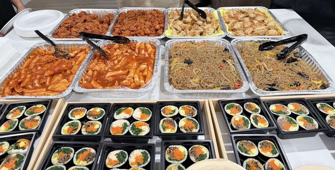 Korean catering trays and kimbap boxes at a UCLA event